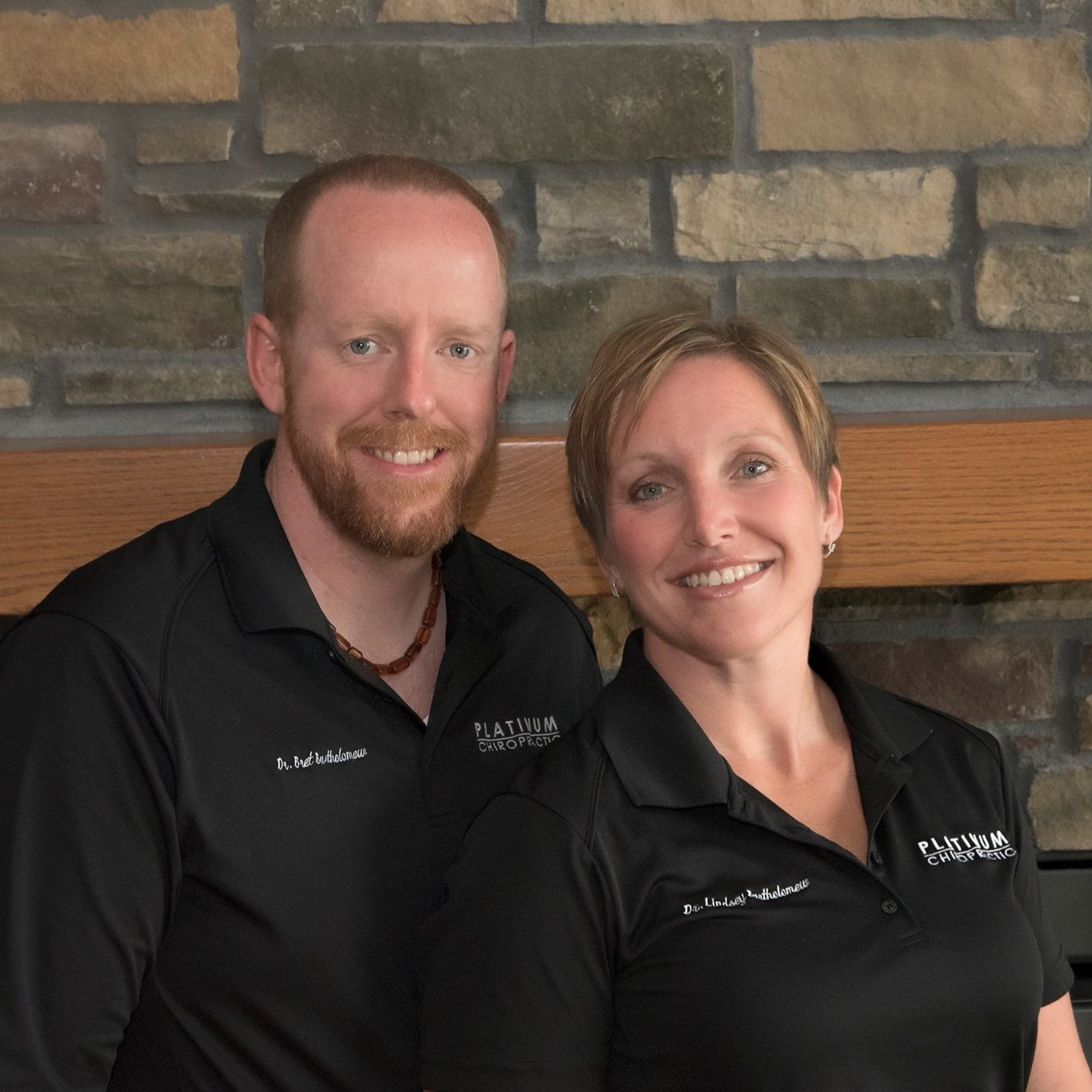 Drs. Bret and Lindsey Bartholomew smiling.