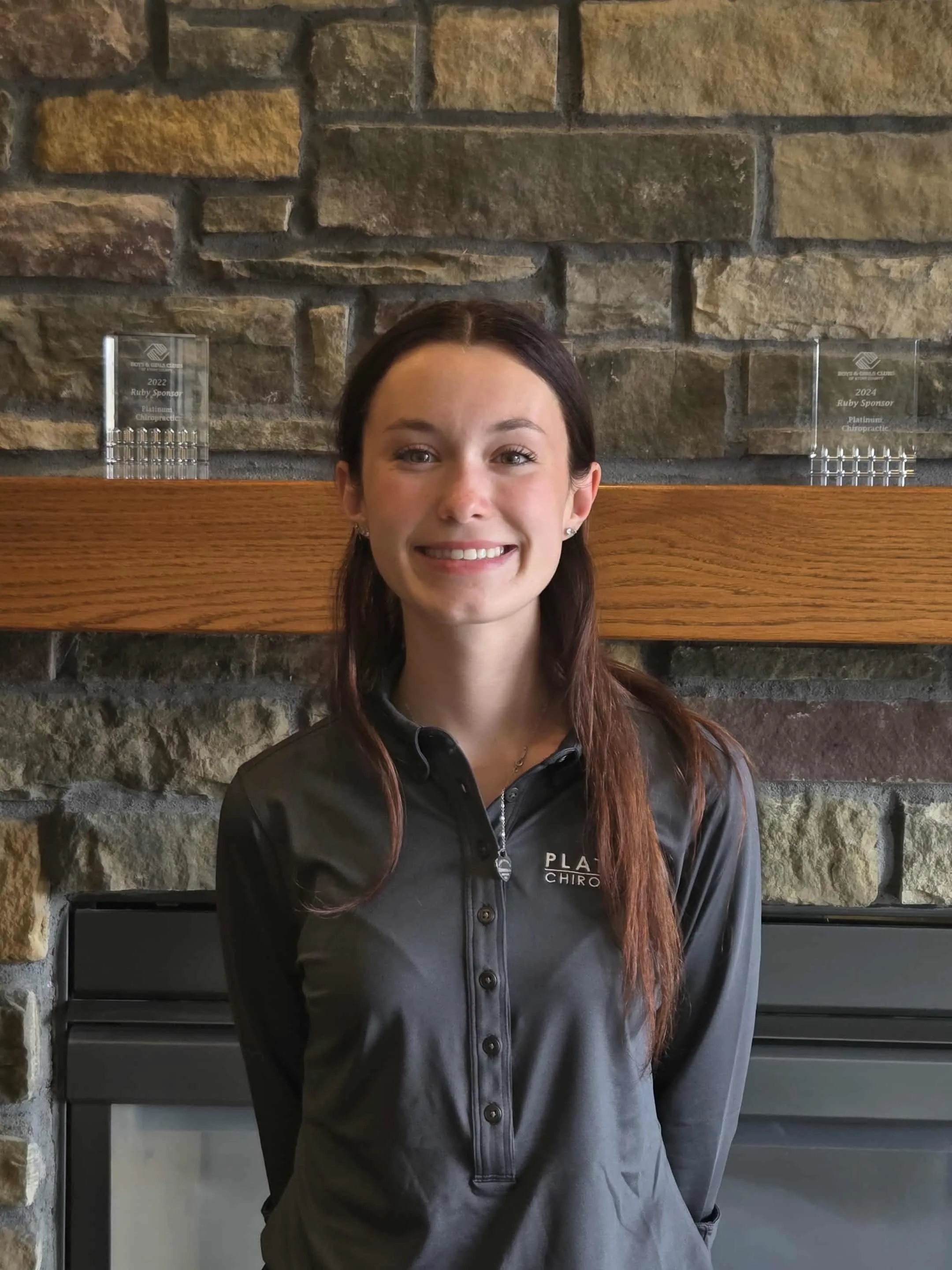 Lola in the office smiling.