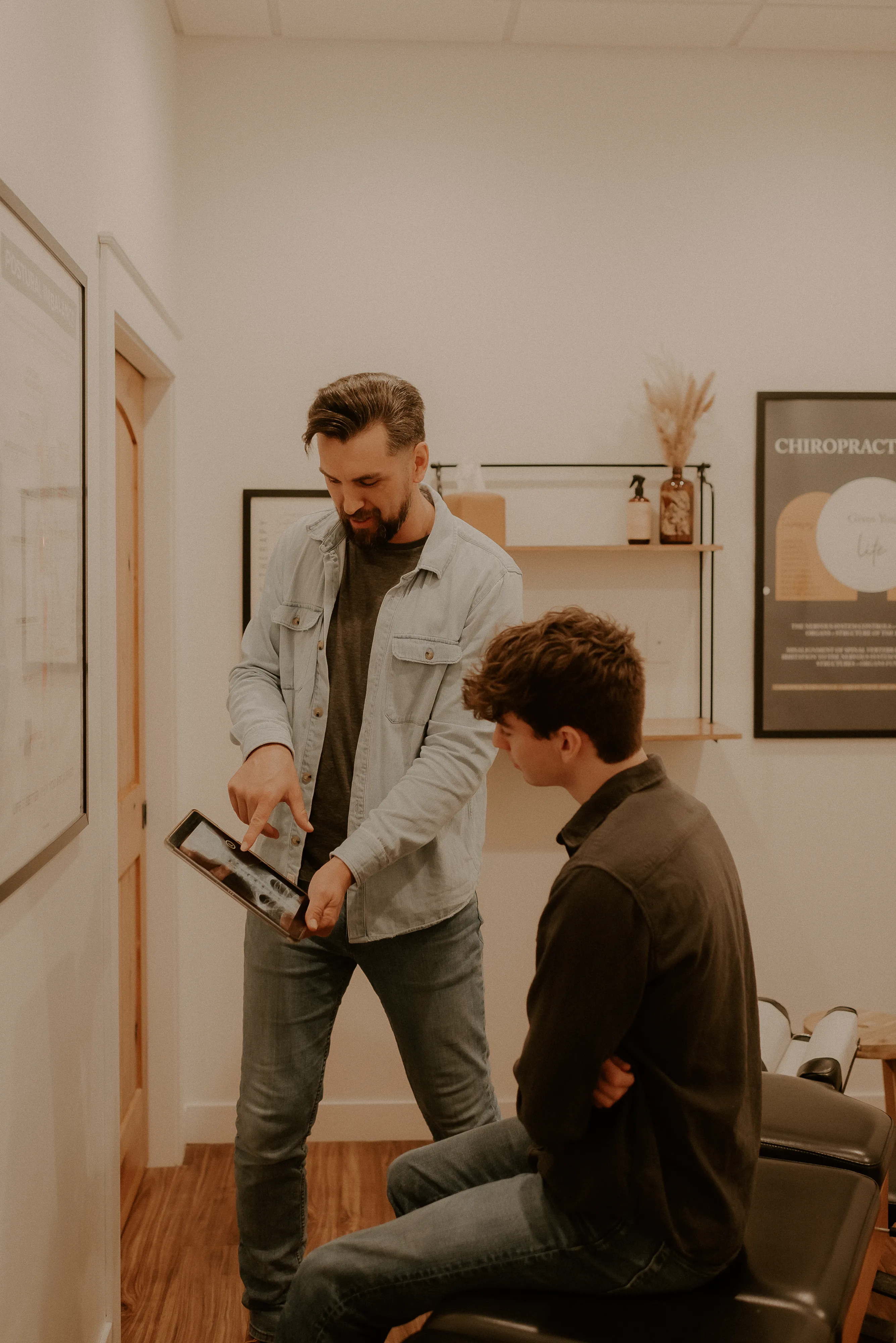 Adult patient completing an INSiGHT nervous system scan at Rise Chiropractic Co.